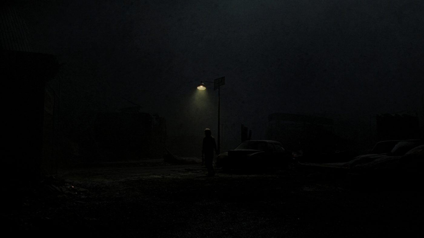 HUSH — foggy ruined street with a lone figure